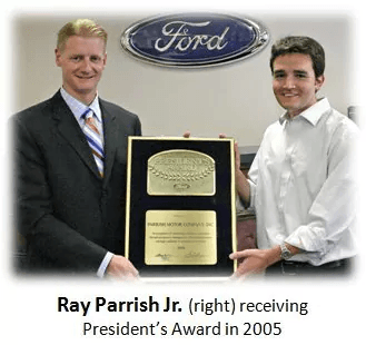 A picture depicting Ray Parrish Jr. receiving the Presidents award
